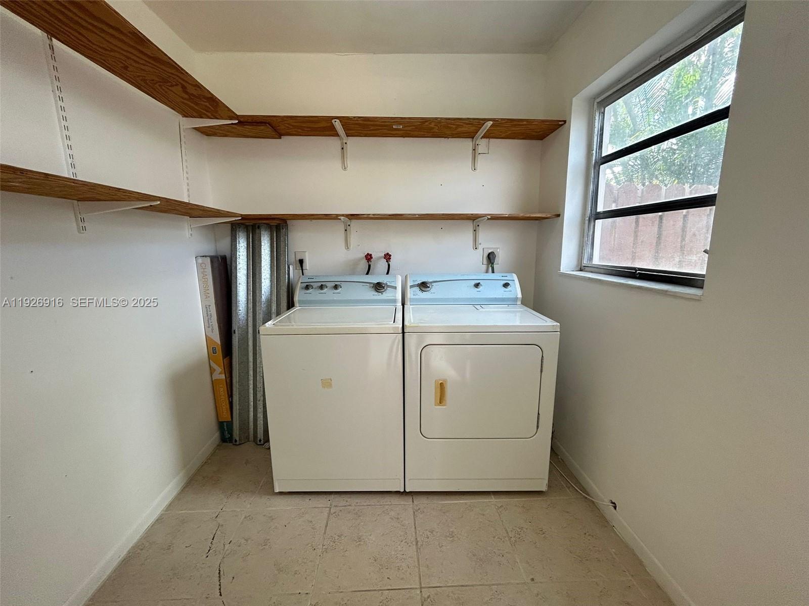 13444 Southwest 62nd Street, Unit 104F Miami, FL 33183 - Photo 38 of 40 a utility room with dryer and washer