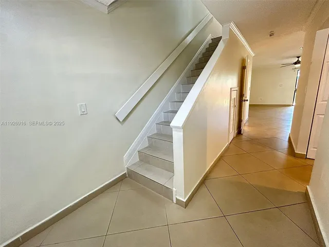 a view of entryway with stairs and wooden floor