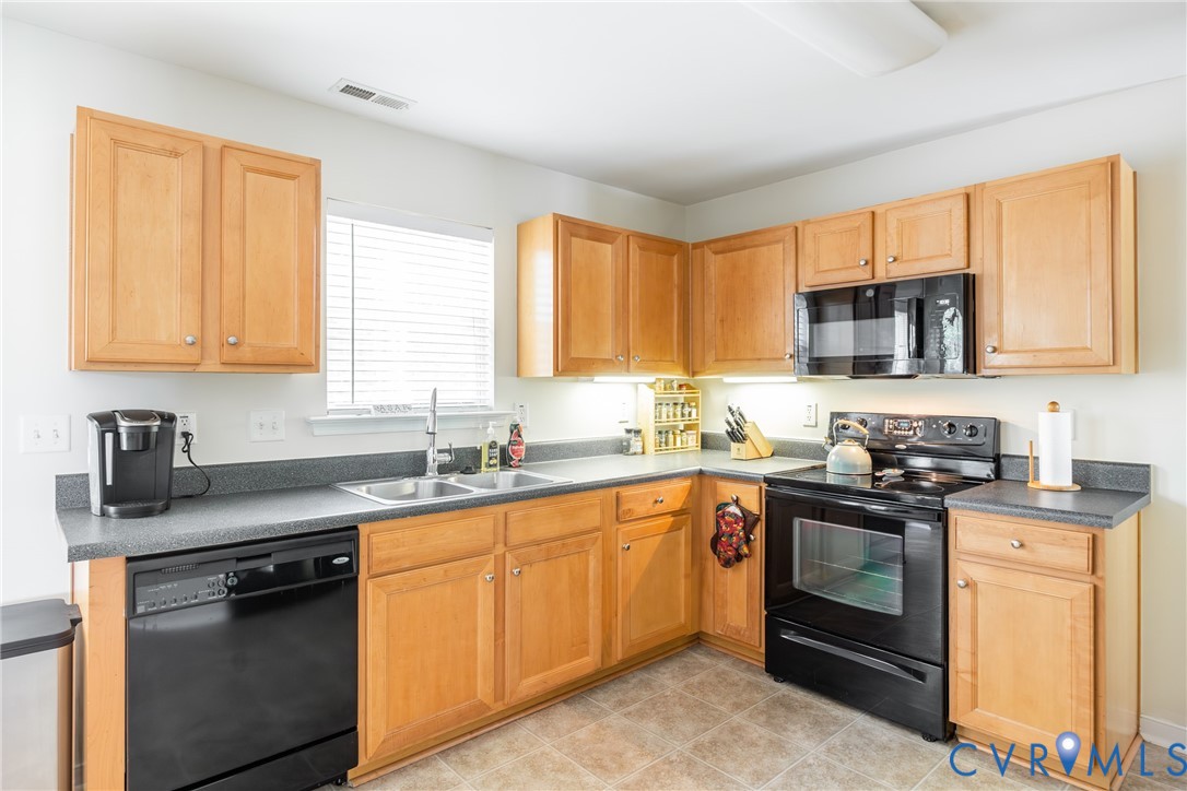 2928 Heather Ridge Drive Henrico, VA 23231 - Photo 16 of 34 Kitchen featuring light wood cabinetry, dark count