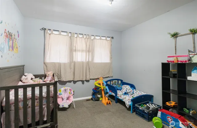a bedroom with bed and a window