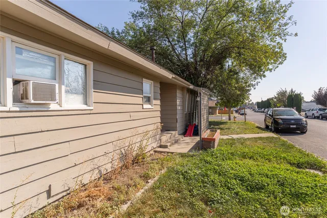 a view of a two chairs in the back yard