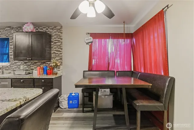 a kitchen with a table chairs and a sink