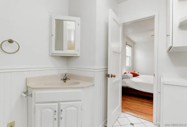 a bathroom with a sink and a mirror