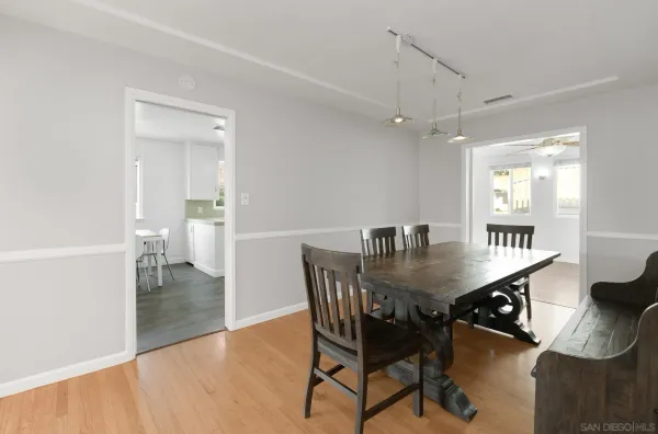 a dining room with furniture and window