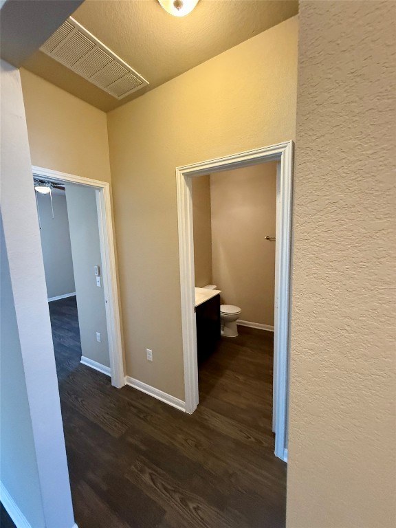 1701 Atlas Road Cedar Park, TX 78613 - Photo 16 of 23 a view of a room with wooden floor and a bathroom
