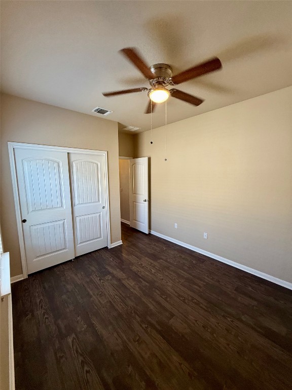 1701 Atlas Road Cedar Park, TX 78613 - Photo 17 of 23 a view of an empty room with wooden floor and a ceiling fan