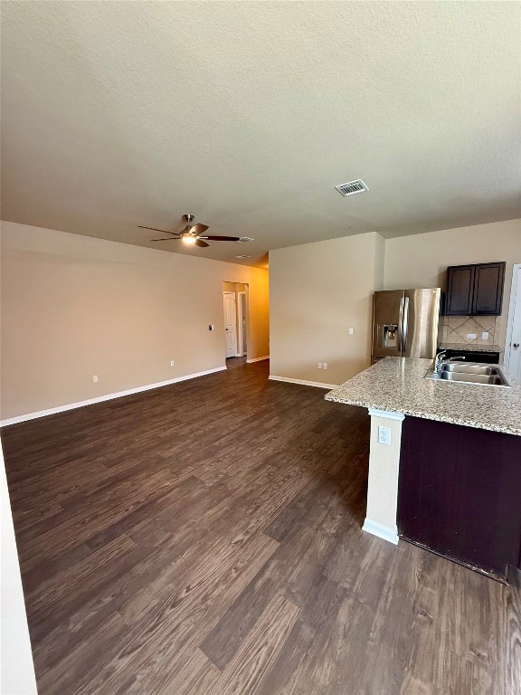 1701 Atlas Road Cedar Park, TX 78613 - Photo 4 of 23 a view of kitchen with granite countertop cabinets and wooden floor