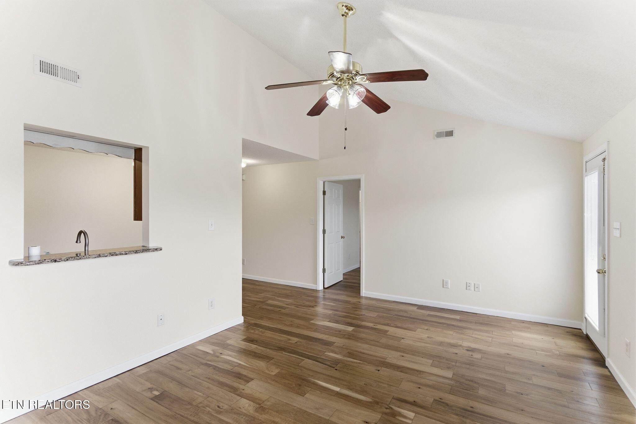 355 Hawthorne Oaks Way Powell, TN 37849 - Photo 14 of 31 a view of an empty room with wooden floor