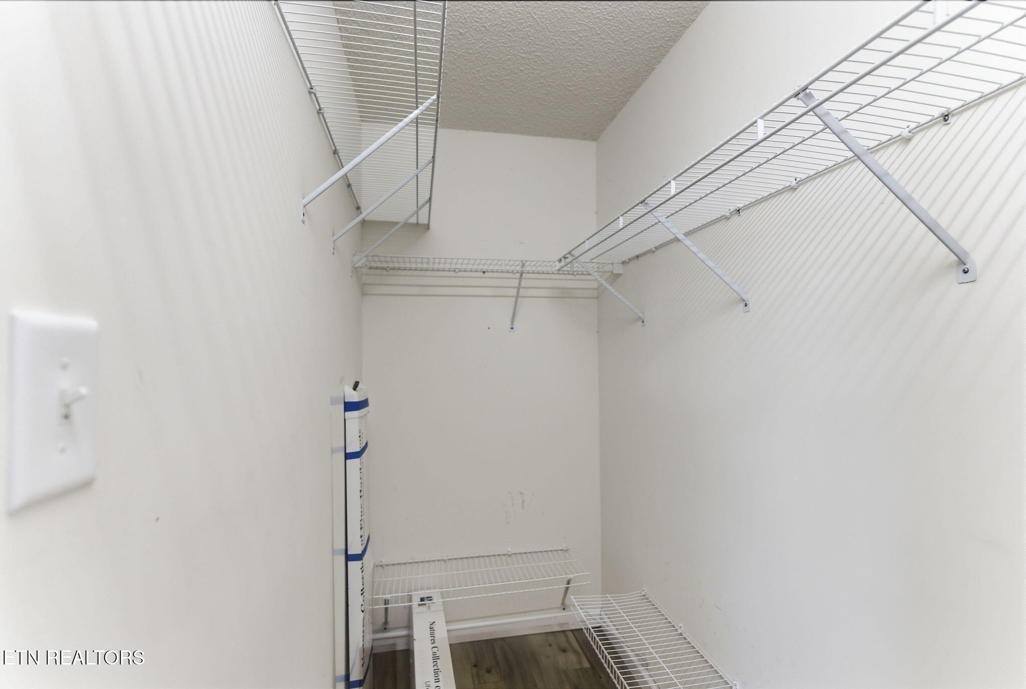 355 Hawthorne Oaks Way Powell, TN 37849 - Photo 20 of 31 a view of storage and utility room with racks on the wall