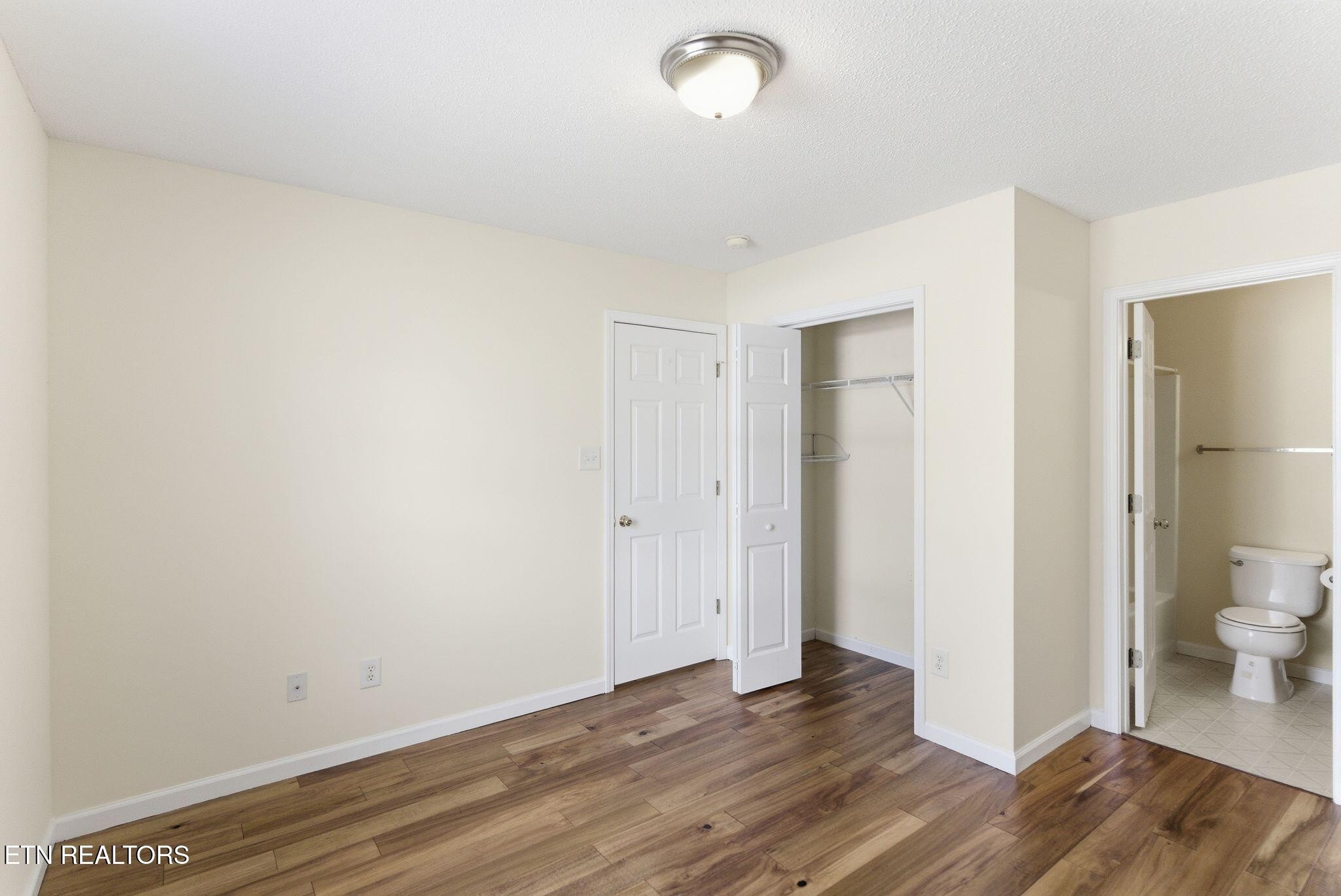 355 Hawthorne Oaks Way Powell, TN 37849 - Photo 22 of 31 a view of a room with wooden floor and bathroom view