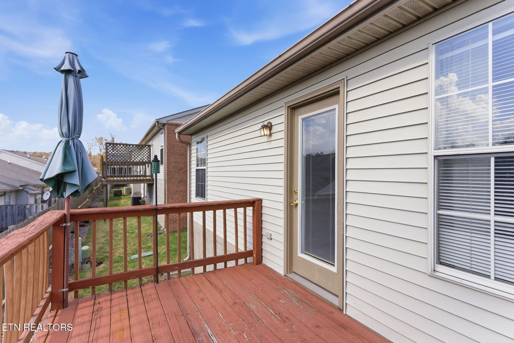 355 Hawthorne Oaks Way Powell, TN 37849 - Photo 26 of 31 a view of a balcony with wooden floor and iron stairs