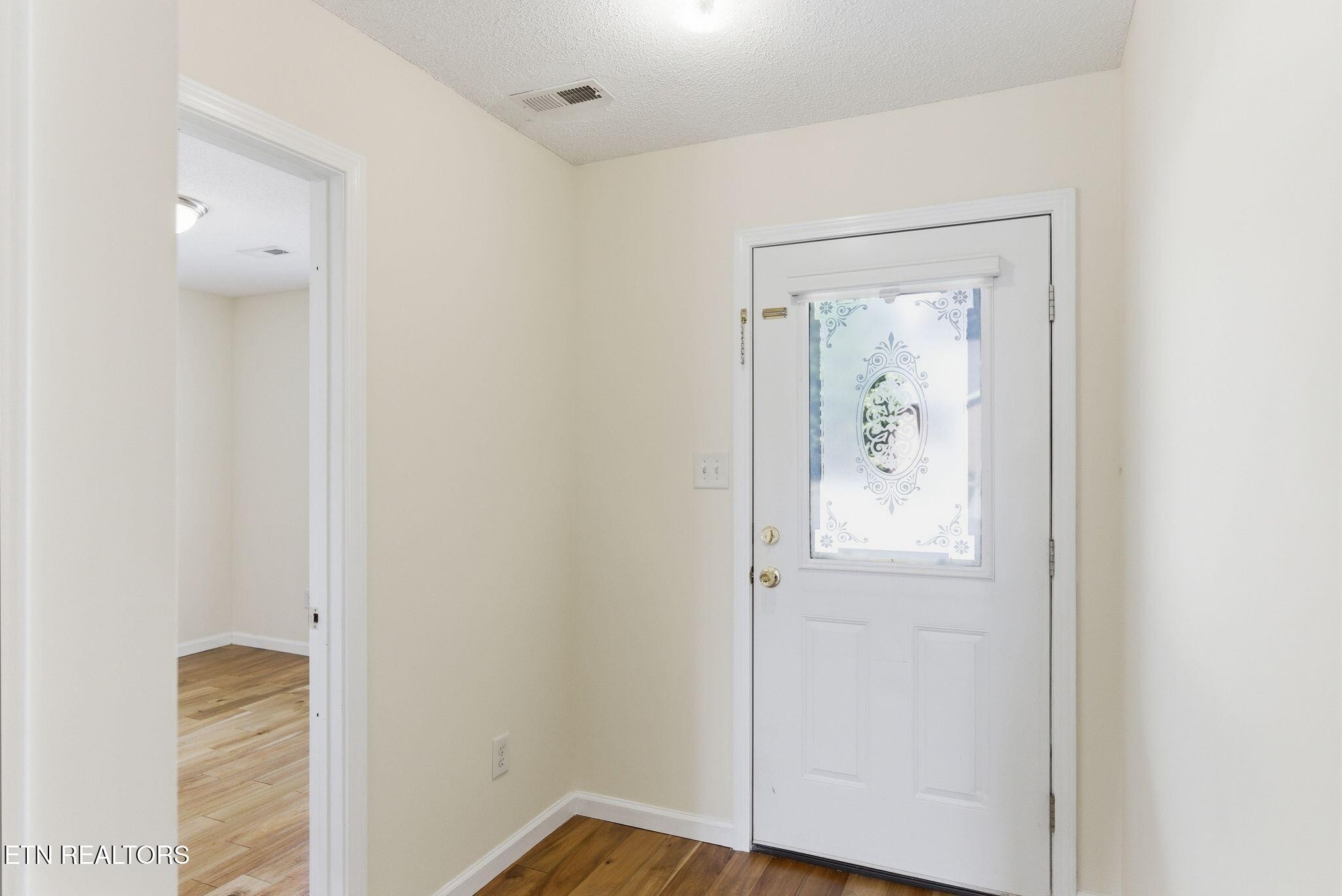 355 Hawthorne Oaks Way Powell, TN 37849 - Photo 7 of 31 a view of room with window and wooden floor
