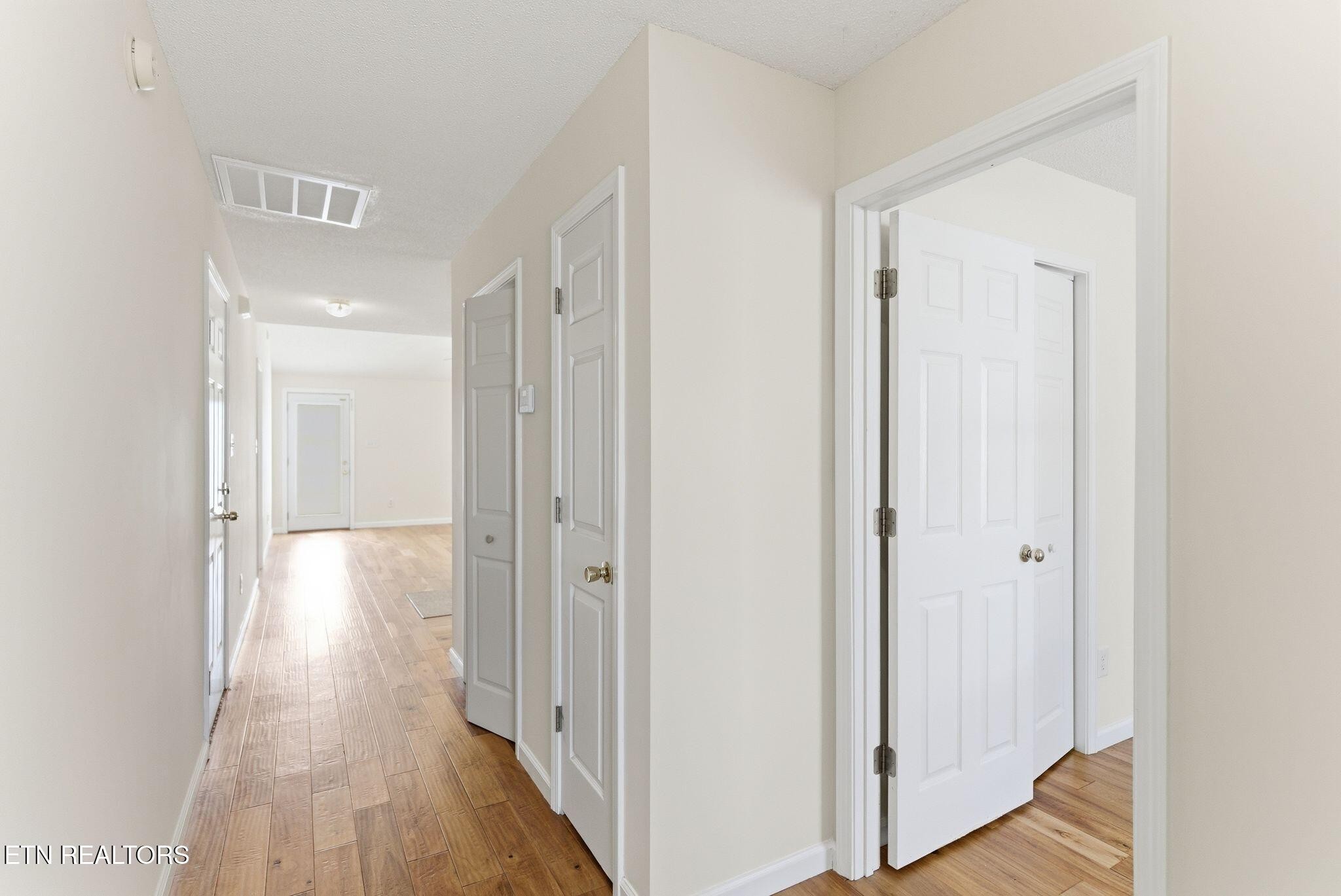 355 Hawthorne Oaks Way Powell, TN 37849 - Photo 8 of 31 a view of a hallway with wooden floor