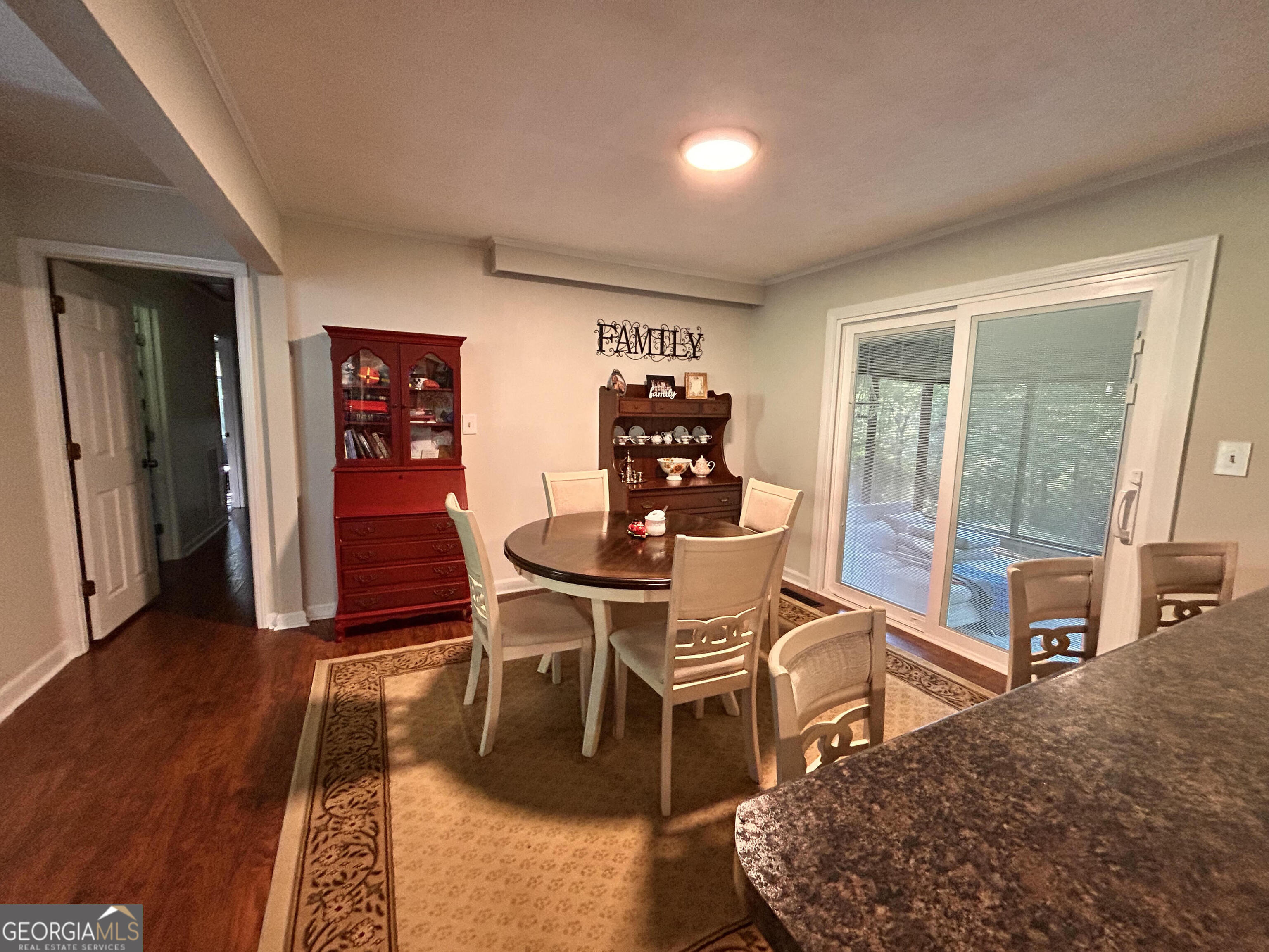 711 West Ridgeway Road Maysville, GA 30558 - Photo 11 of 38 a dining room with furniture and wooden floor