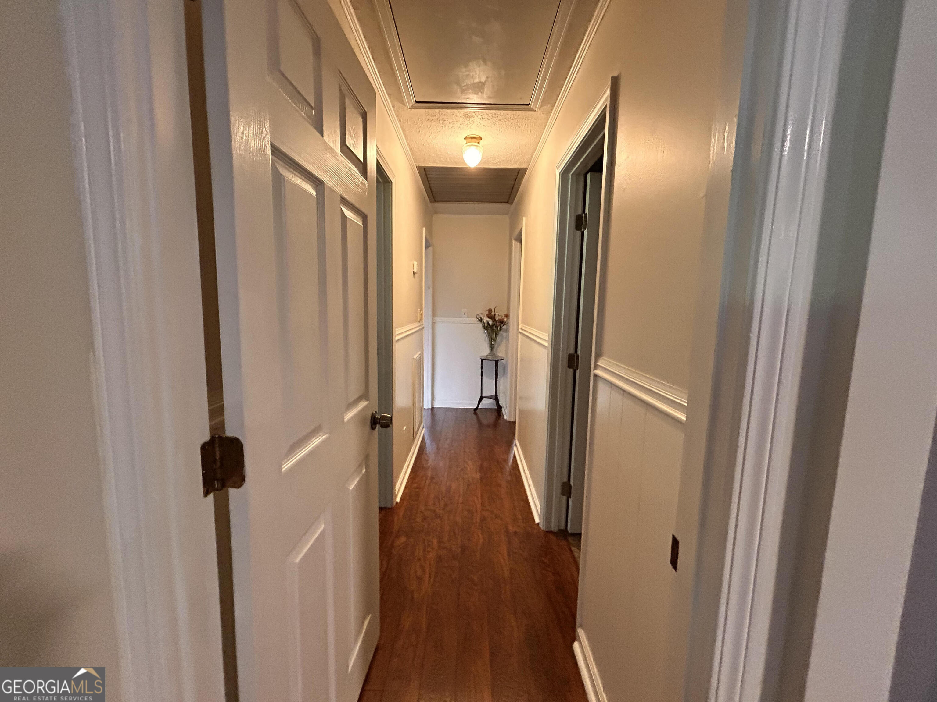 711 West Ridgeway Road Maysville, GA 30558 - Photo 12 of 38 a view of a hallway with wooden floor and staircase