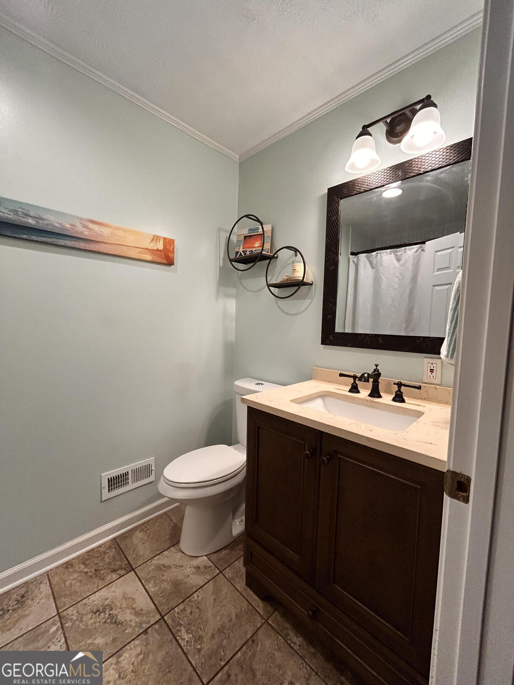 711 West Ridgeway Road Maysville, GA 30558 - Photo 20 of 38 a bathroom with a toilet a sink and mirror