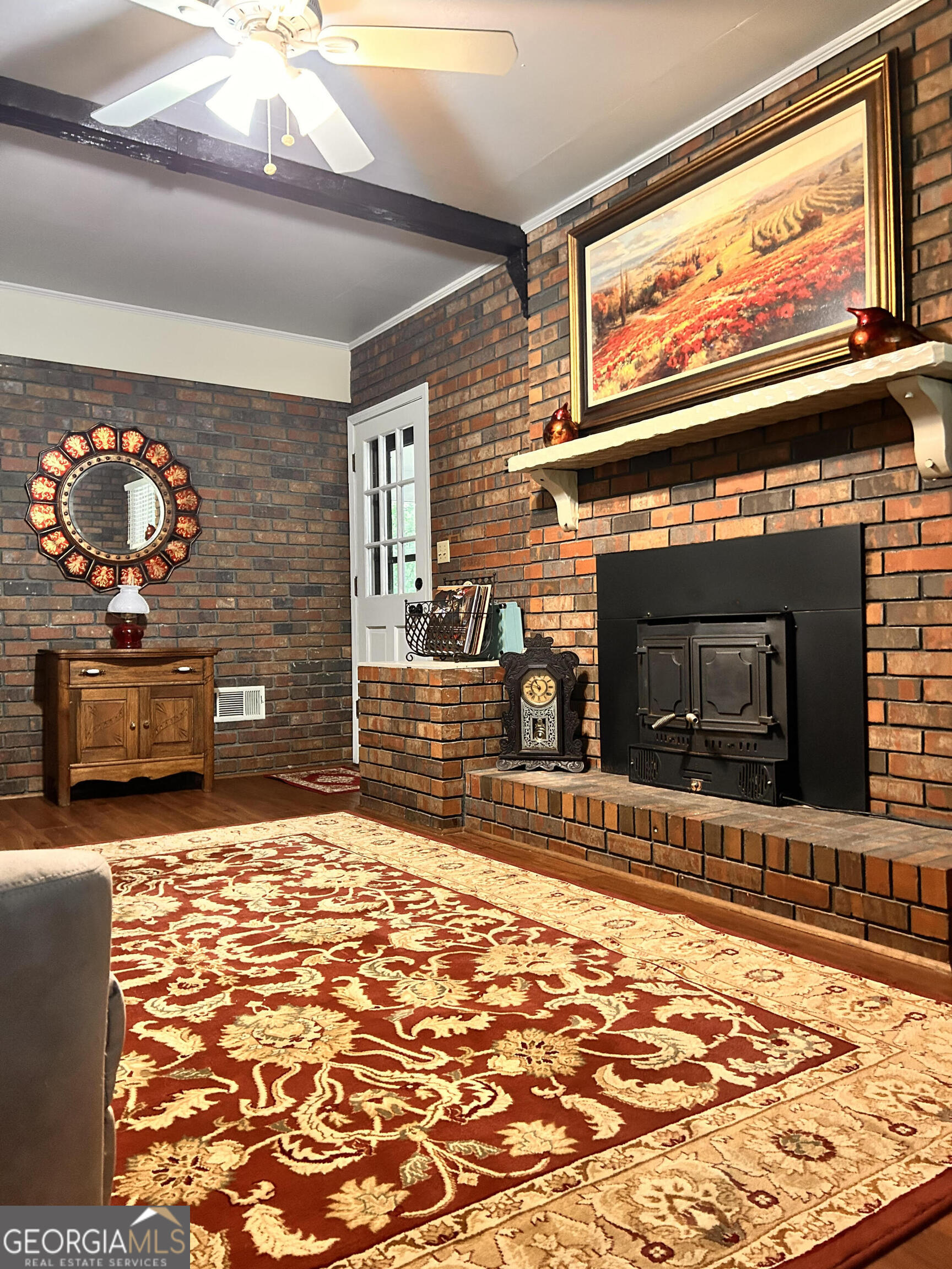 711 West Ridgeway Road Maysville, GA 30558 - Photo 2 of 38 a living room with fireplace furniture and a flat screen tv