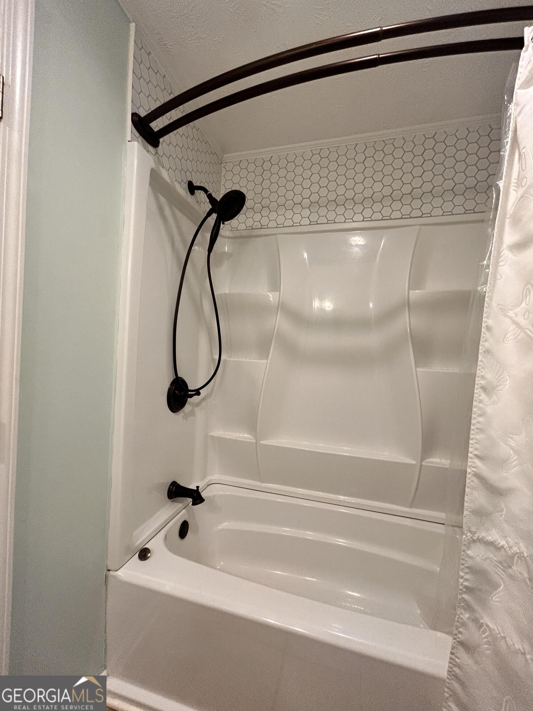 711 West Ridgeway Road Maysville, GA 30558 - Photo 21 of 38 a bathroom with a bath tub and a shower