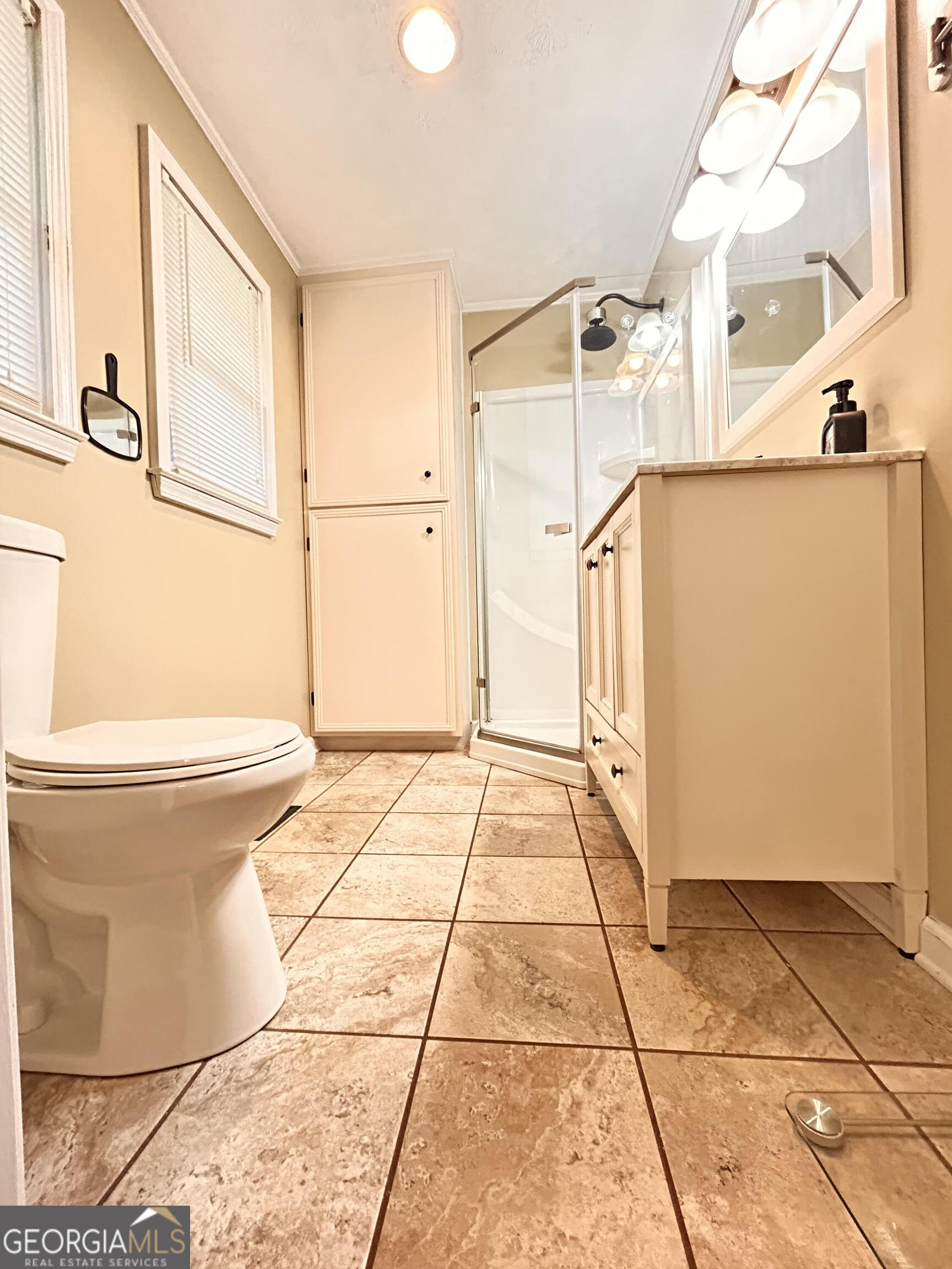 711 West Ridgeway Road Maysville, GA 30558 - Photo 23 of 38 a bathroom with a toilet and a shower