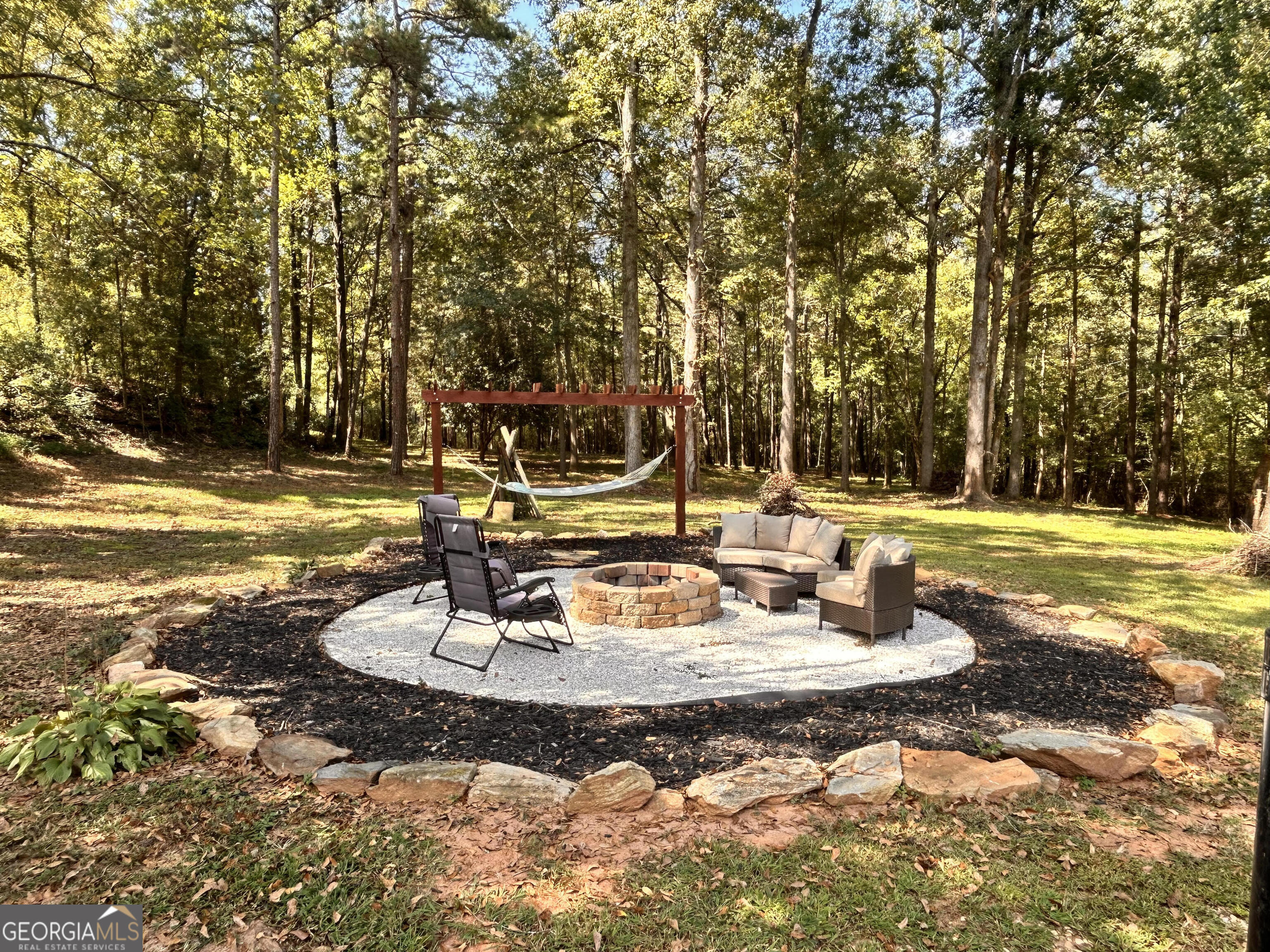 711 West Ridgeway Road Maysville, GA 30558 - Photo 25 of 38 a view of a swimming pool with a patio
