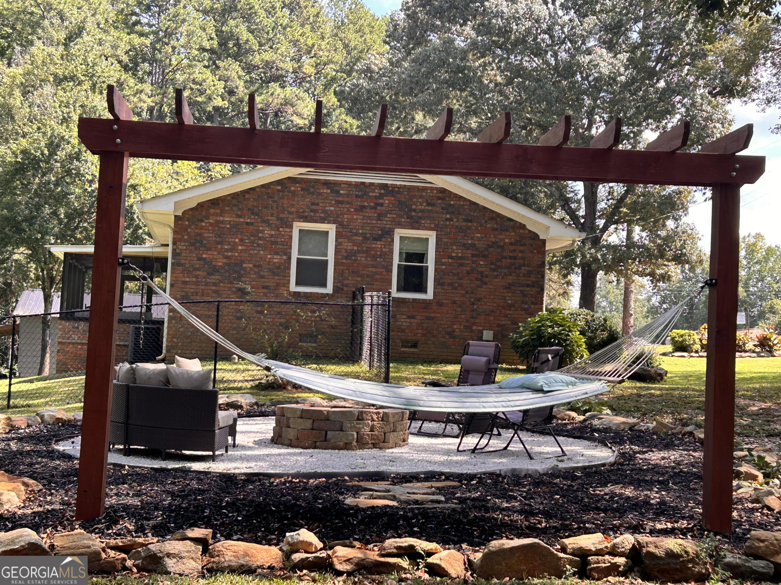 711 West Ridgeway Road Maysville, GA 30558 - Photo 28 of 38 a front view of a house with garden
