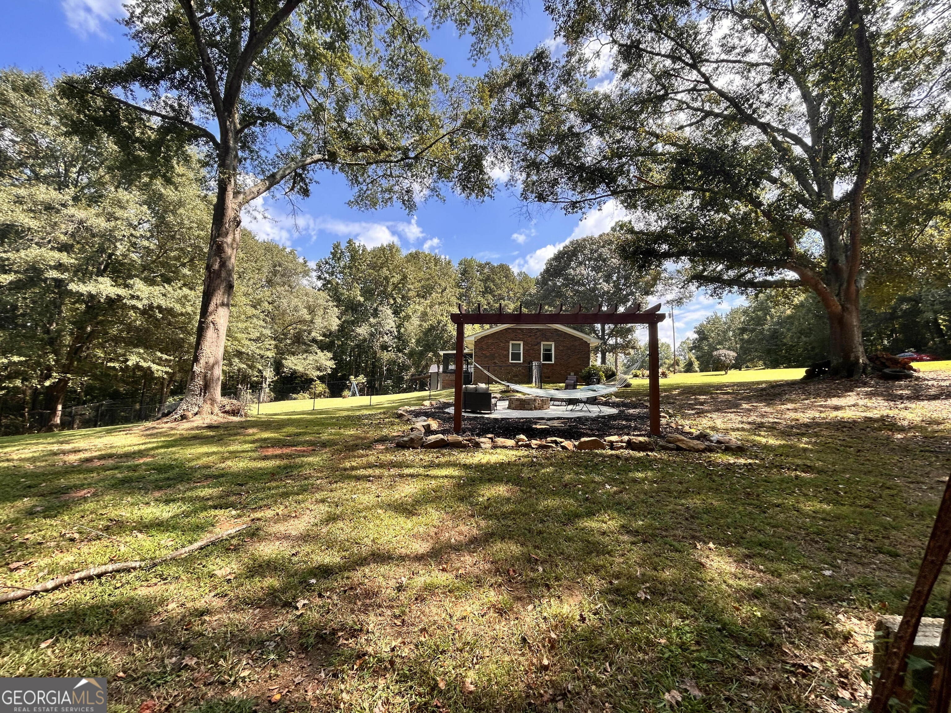 711 West Ridgeway Road Maysville, GA 30558 - Photo 29 of 38 a view of a lake with a trees