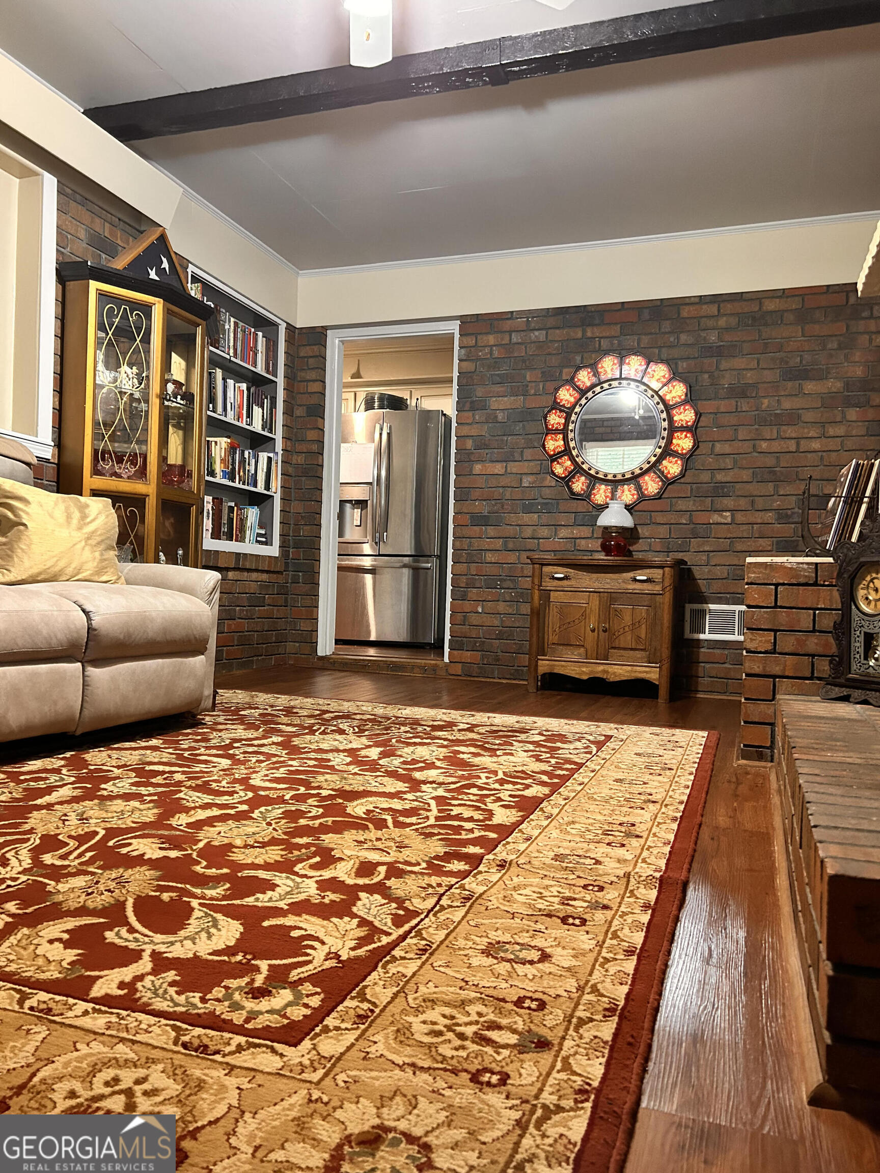 711 West Ridgeway Road Maysville, GA 30558 - Photo 3 of 38 a living room with fireplace furniture and a flat screen tv