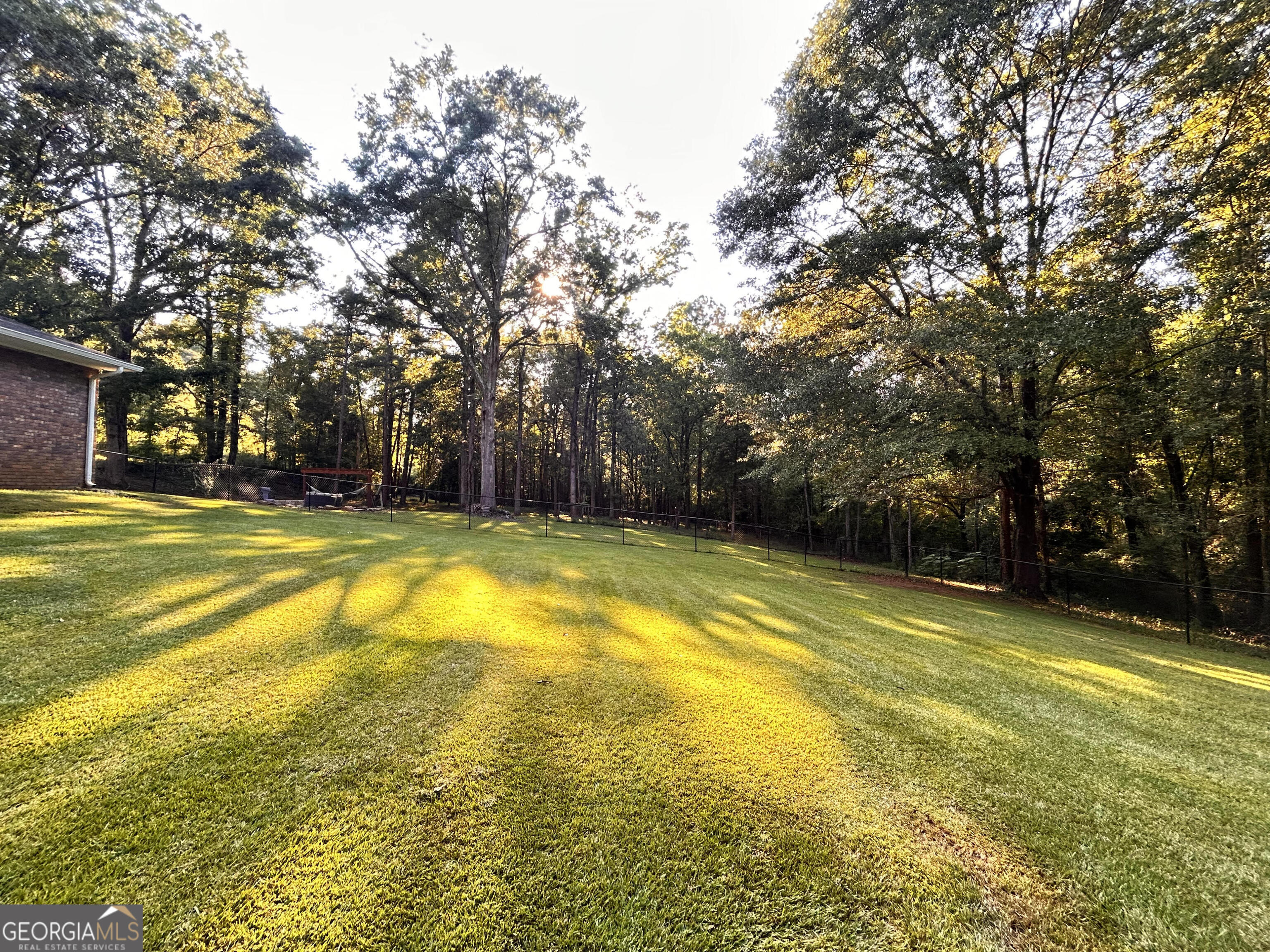 711 West Ridgeway Road Maysville, GA 30558 - Photo 33 of 38 a view of a swimming pool with an outdoor space and seating area