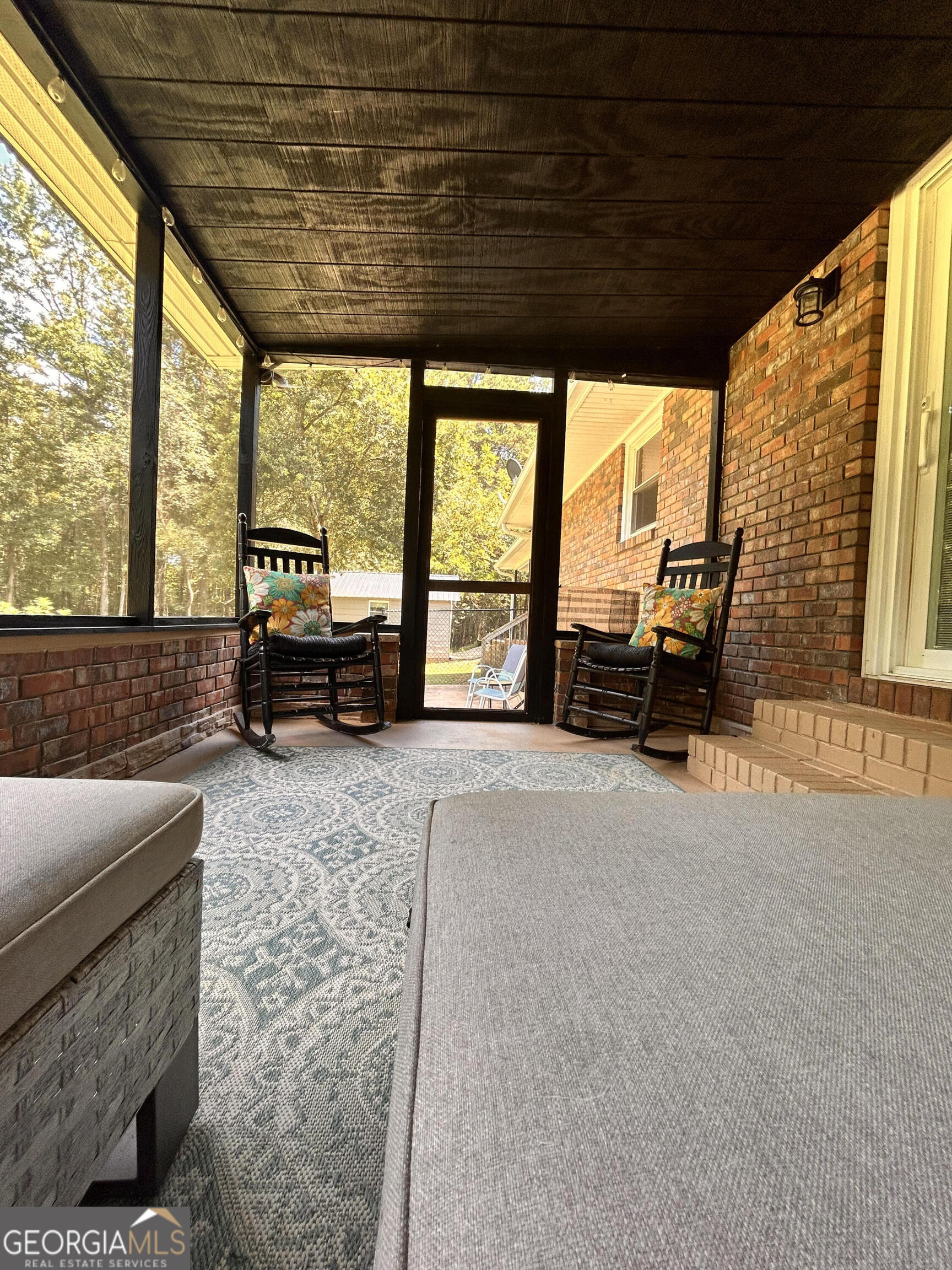 711 West Ridgeway Road Maysville, GA 30558 - Photo 35 of 38 a living room with furniture tv and large windows