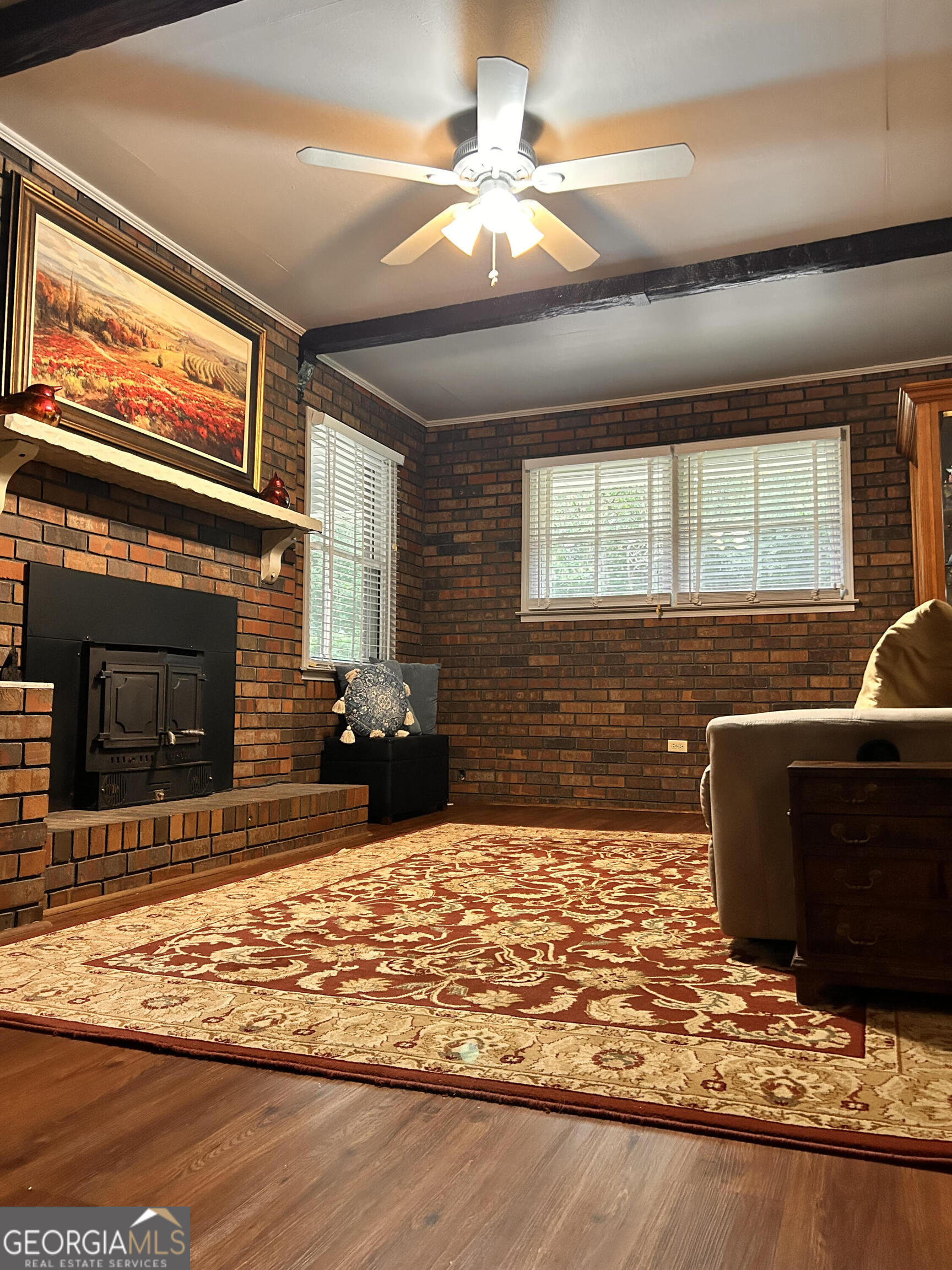 711 West Ridgeway Road Maysville, GA 30558 - Photo 4 of 38 a view of a fireplace with wooden floor