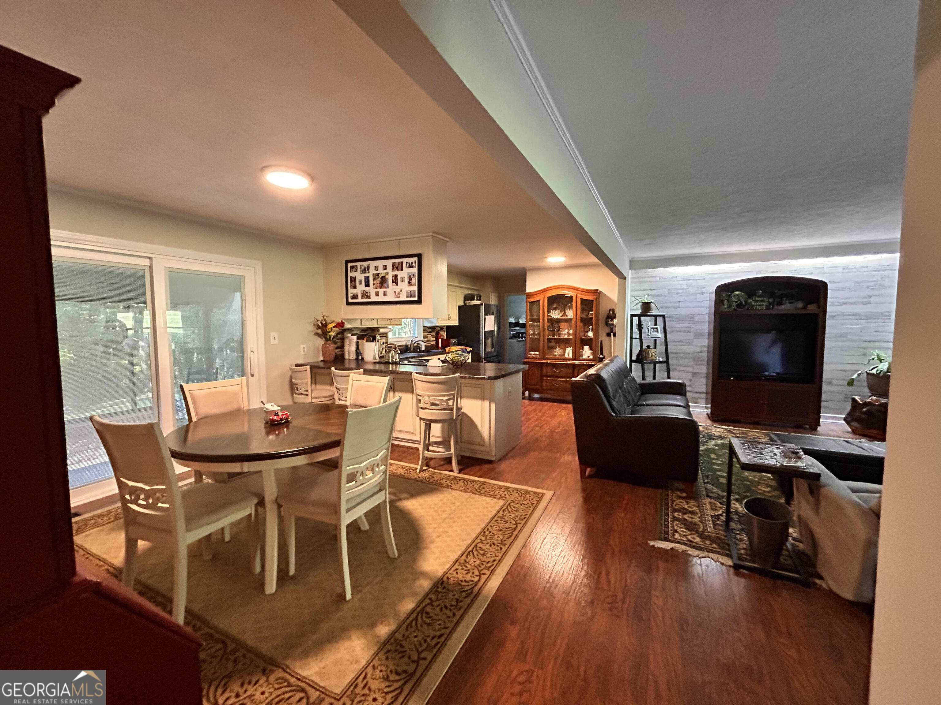 711 West Ridgeway Road Maysville, GA 30558 - Photo 6 of 38 a view of a dining room with furniture wooden floor and windows