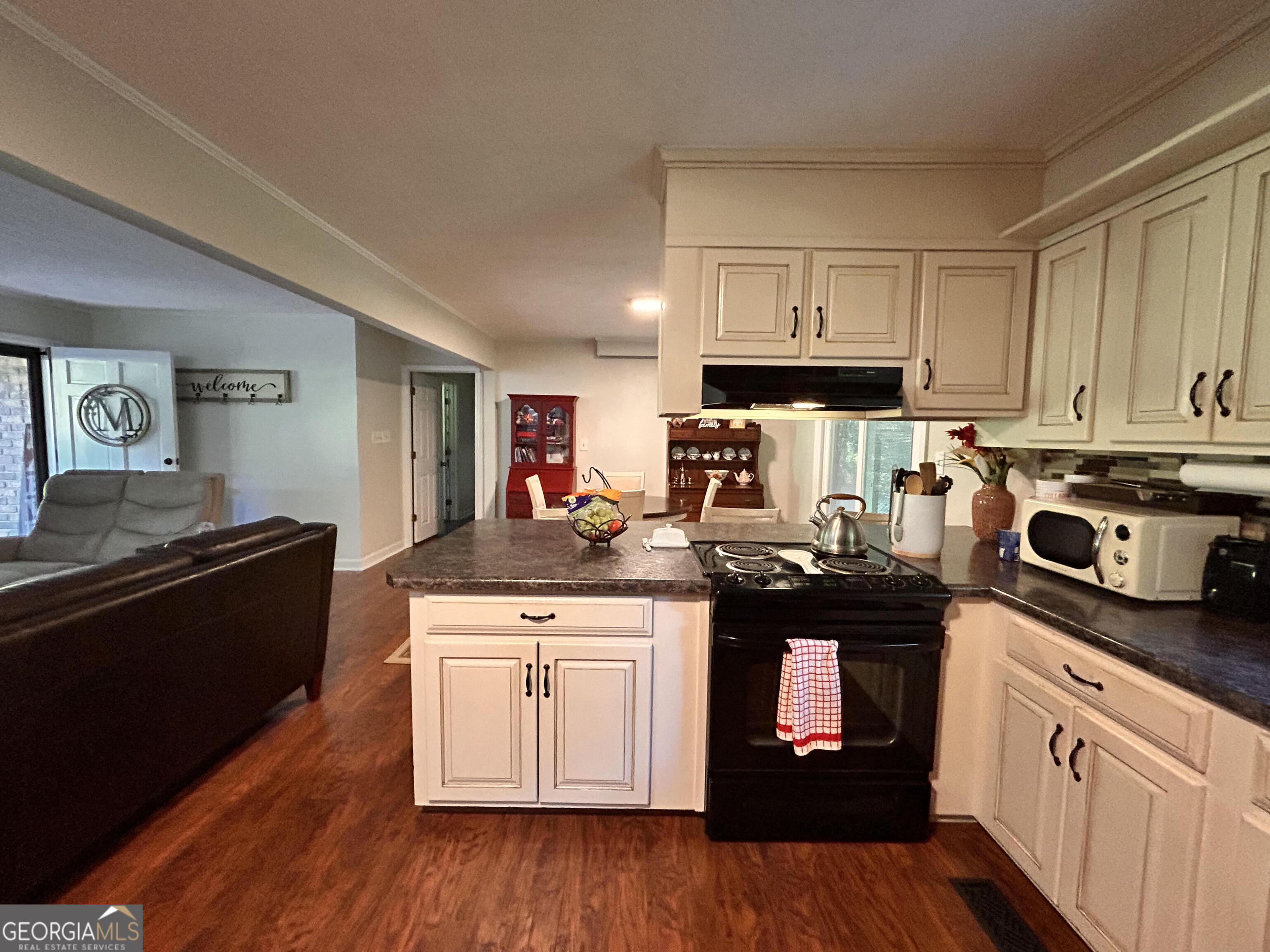 711 West Ridgeway Road Maysville, GA 30558 - Photo 7 of 38 a kitchen with a stove and a refrigerator