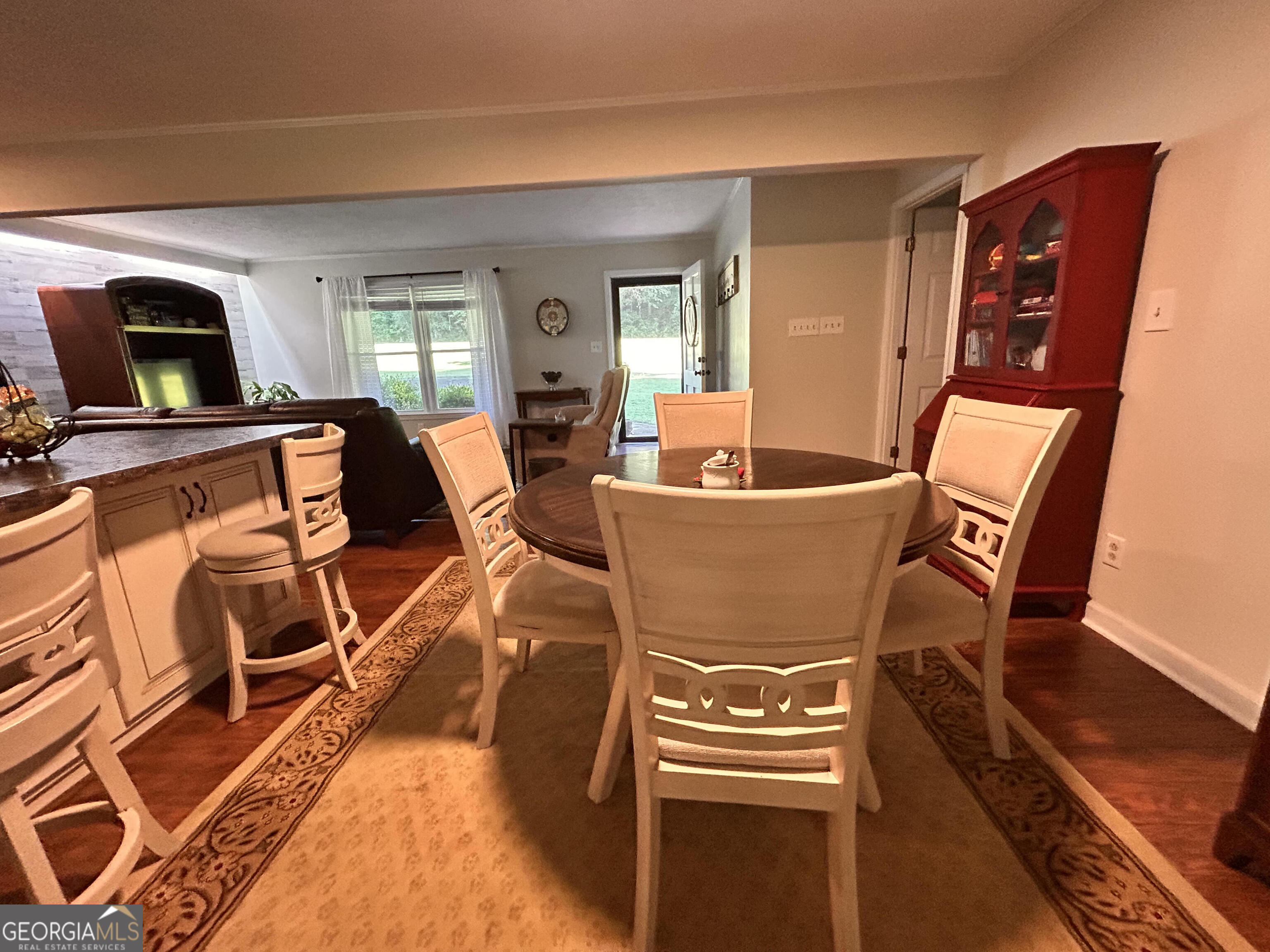 711 West Ridgeway Road Maysville, GA 30558 - Photo 9 of 38 a view of a dining room with furniture window and wooden floor