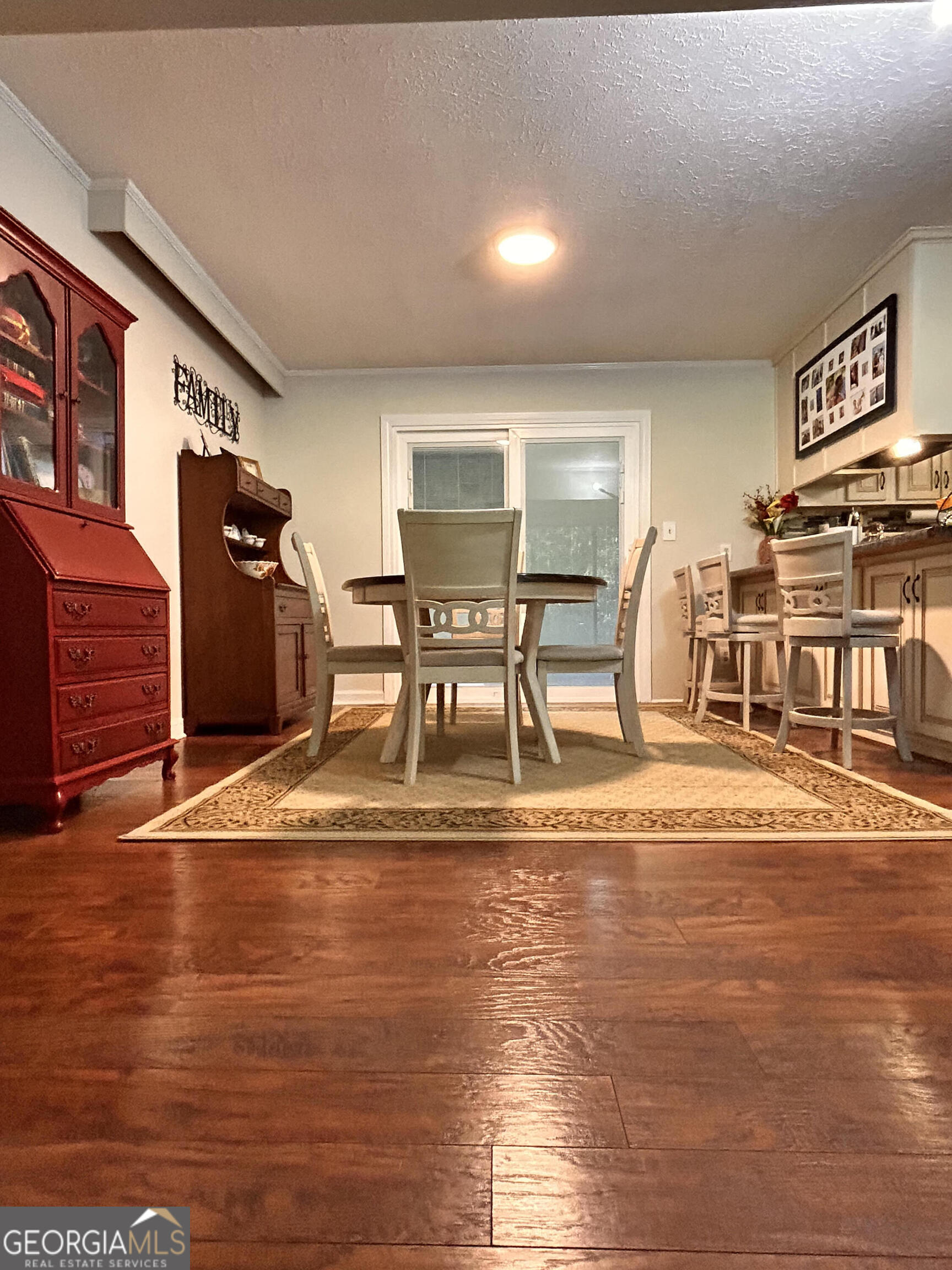 711 West Ridgeway Road Maysville, GA 30558 - Photo 10 of 38 a view of a dining room with furniture and wooden floor