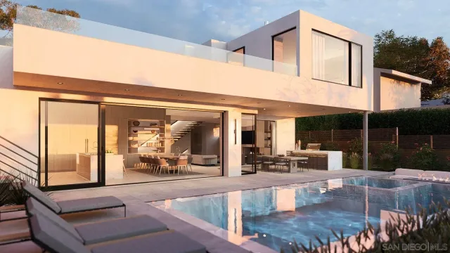 a view of a house with swimming pool and sitting area