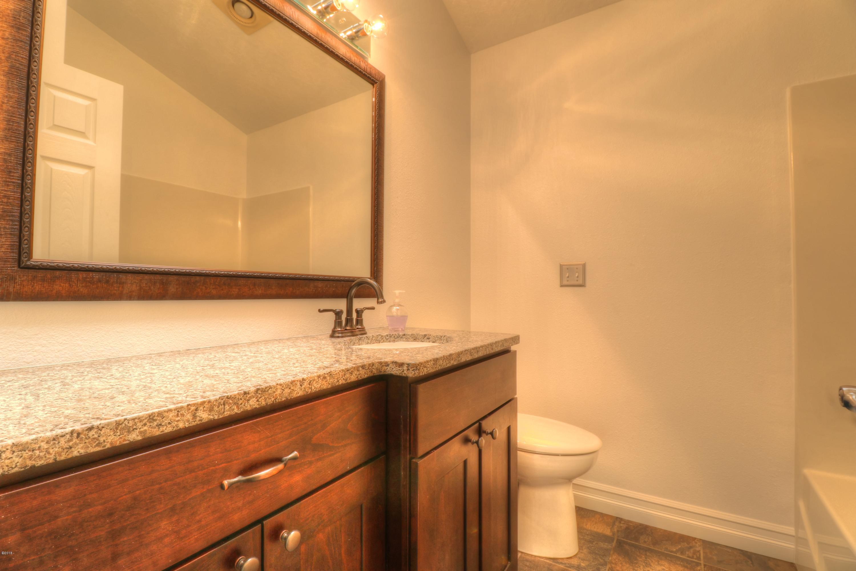 9775 Southeast Cedar Street South Beach, OR 97366 - Photo 24 of 33 Guest Bath 1