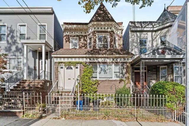 a front view of a building with a street