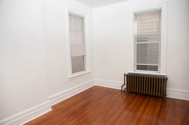 a view of room with window and hardwood floor