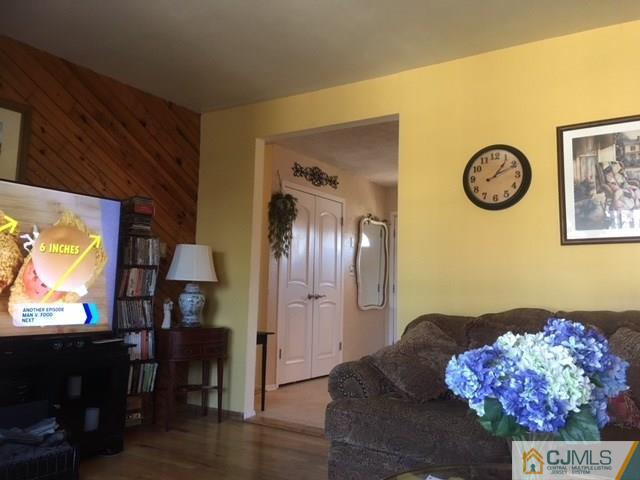 21 Georgetown Road Old Bridge, NJ 08859 - Photo 8 of 17 a living room with furniture and a flat screen tv