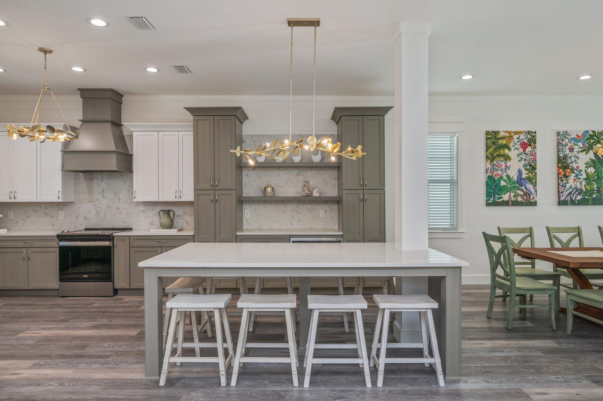 59 Marthas Lane Santa Rosa Beach, FL 32459 - Photo 22 of 85 a kitchen with kitchen island granite countertop a table and chairs in it
