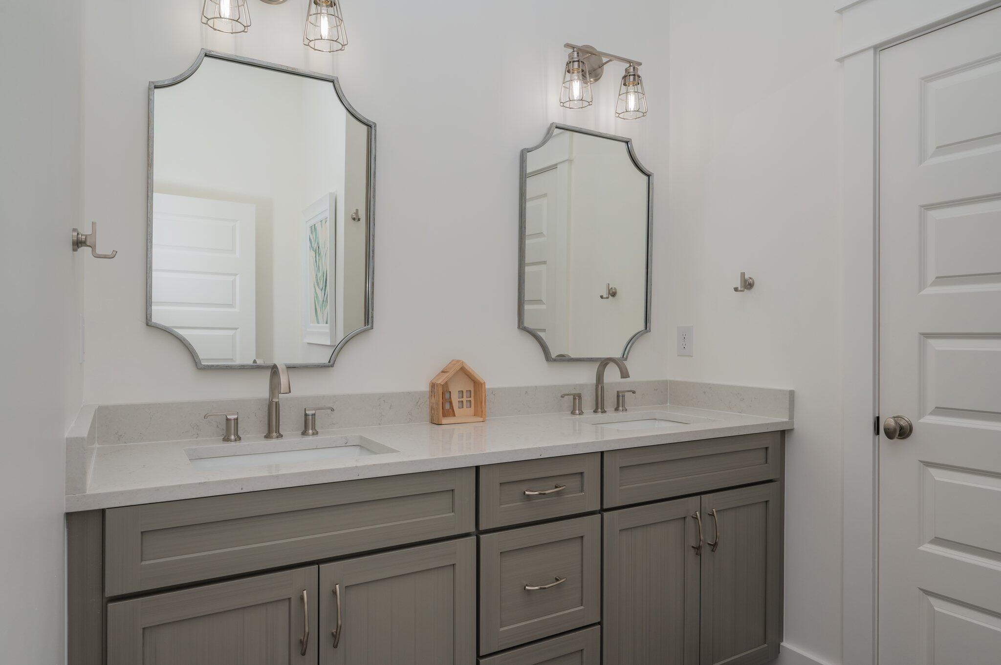 59 Marthas Lane Santa Rosa Beach, FL 32459 - Photo 29 of 85 a bathroom with double vanity sinks and a mirror