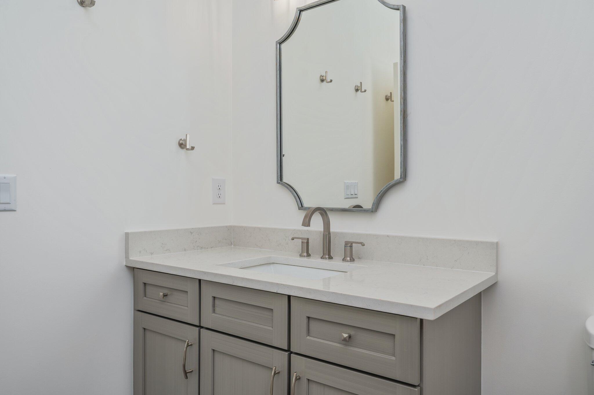 59 Marthas Lane Santa Rosa Beach, FL 32459 - Photo 34 of 85 a bathroom with a sink and a mirror