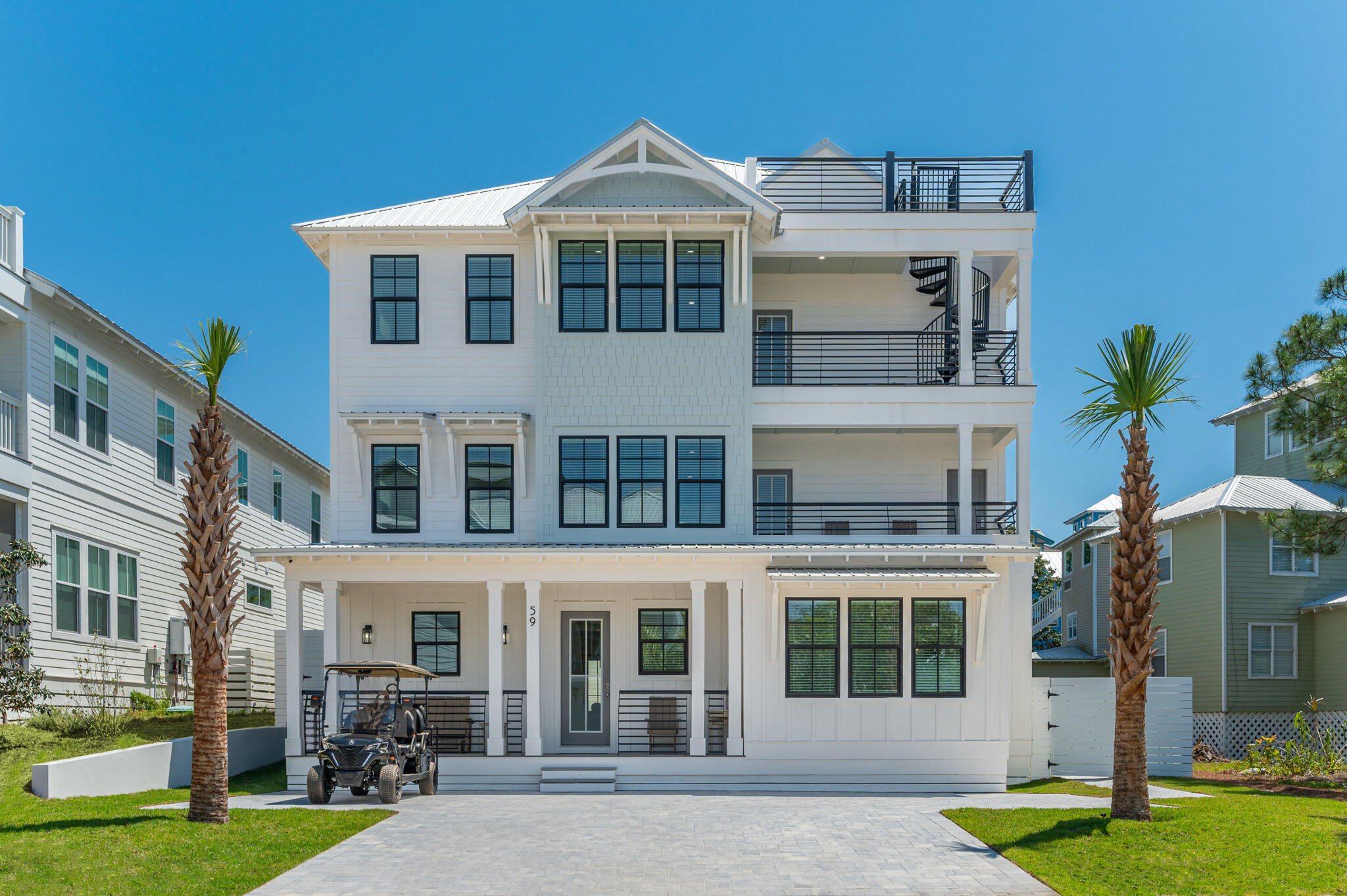59 Marthas Lane Santa Rosa Beach, FL 32459 - Photo 4 of 85 a front view of a building with garden