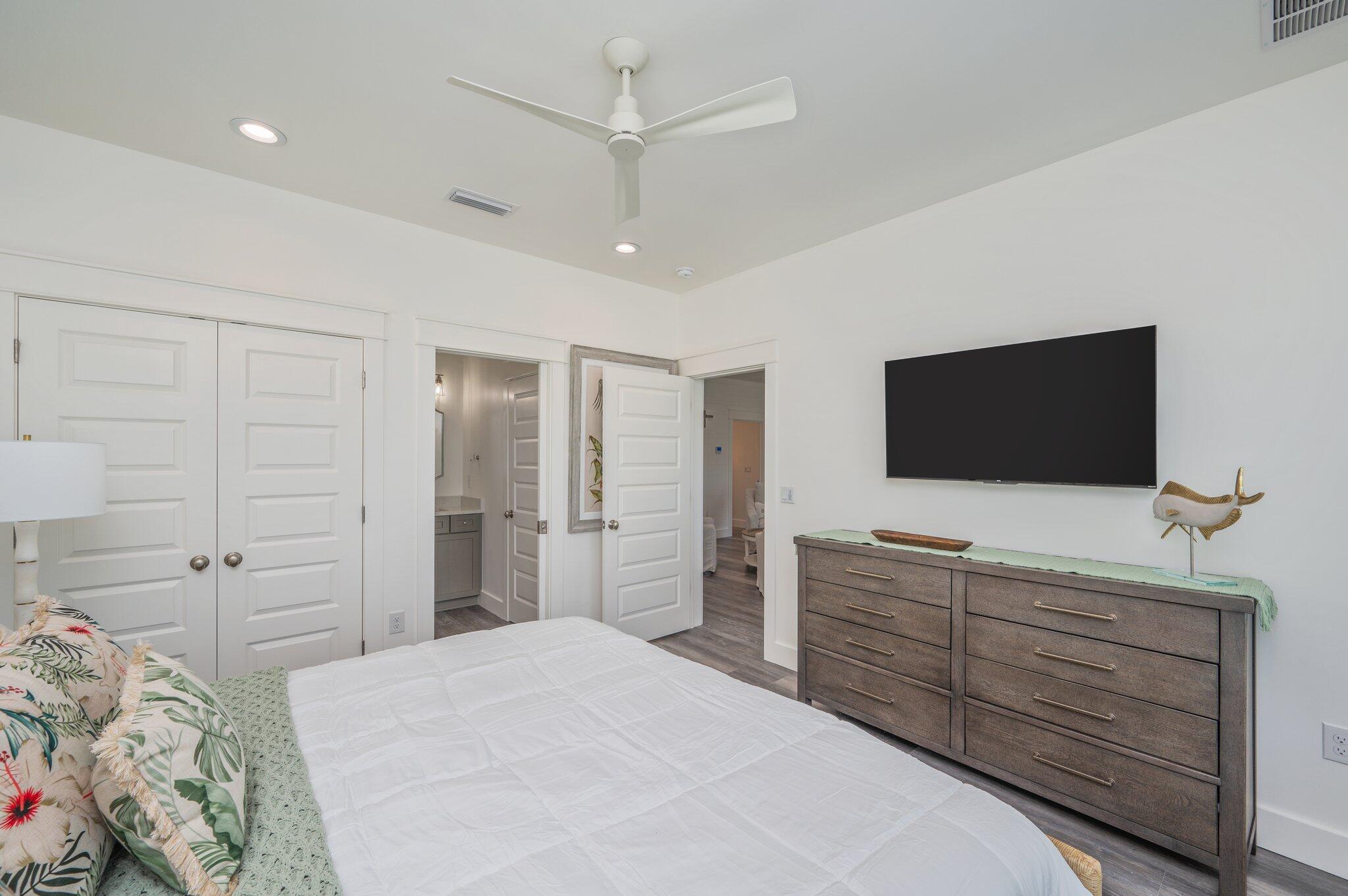 59 Marthas Lane Santa Rosa Beach, FL 32459 - Photo 41 of 85 a bedroom with a bed and a flat screen tv