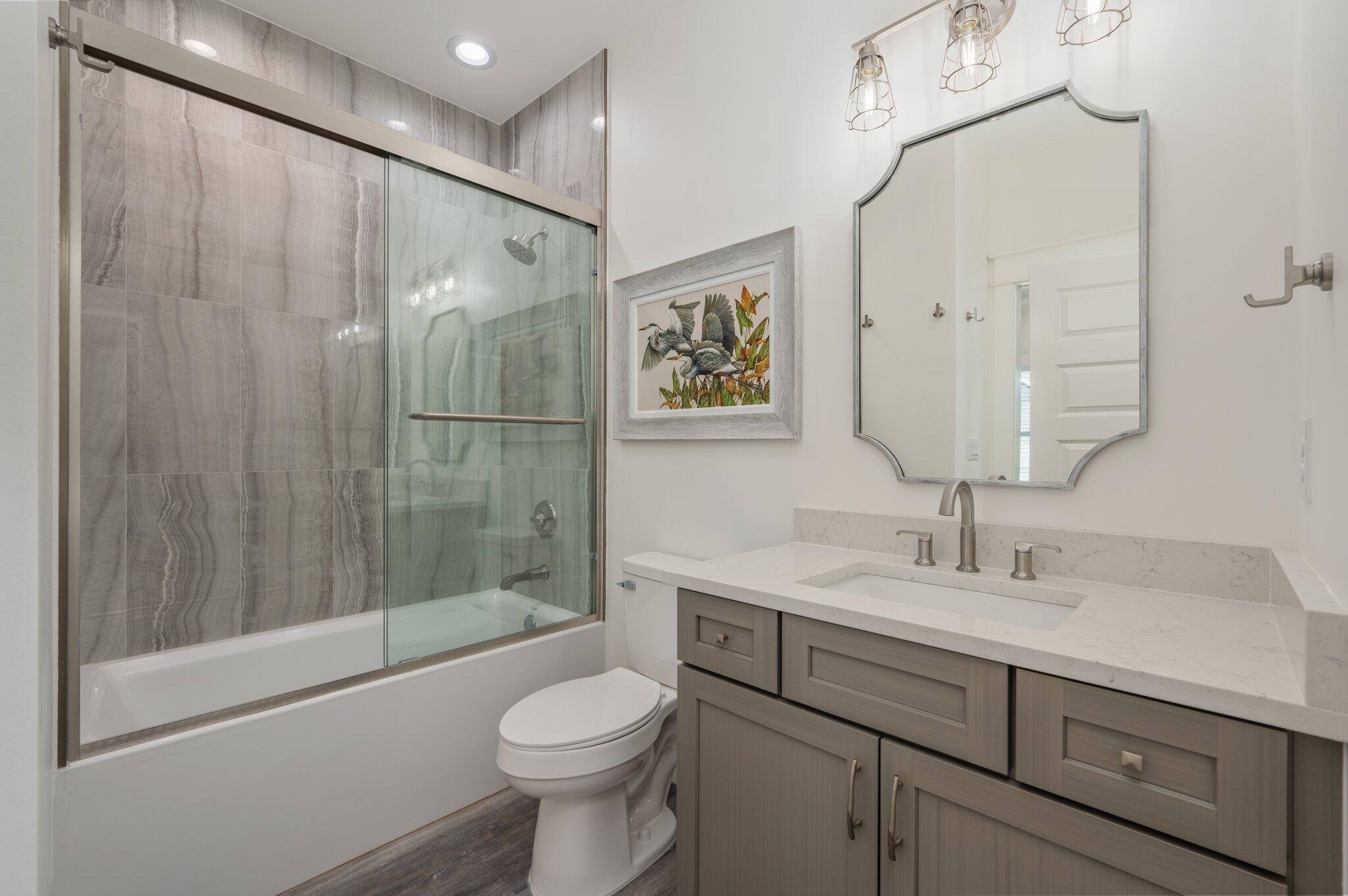 59 Marthas Lane Santa Rosa Beach, FL 32459 - Photo 42 of 85 a bathroom with a sink a toilet and shower