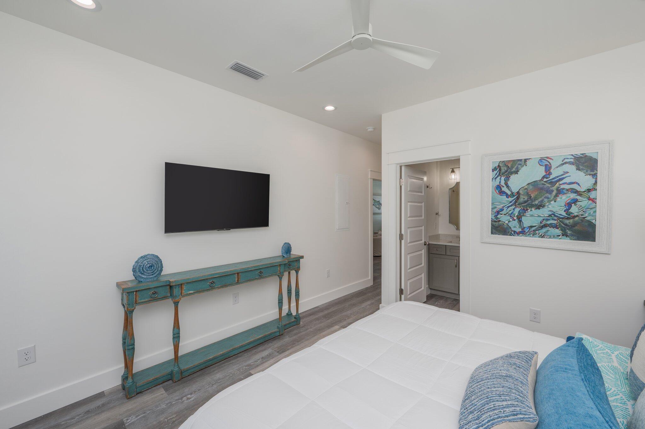 59 Marthas Lane Santa Rosa Beach, FL 32459 - Photo 45 of 85 a bedroom with a bed and a flat screen tv