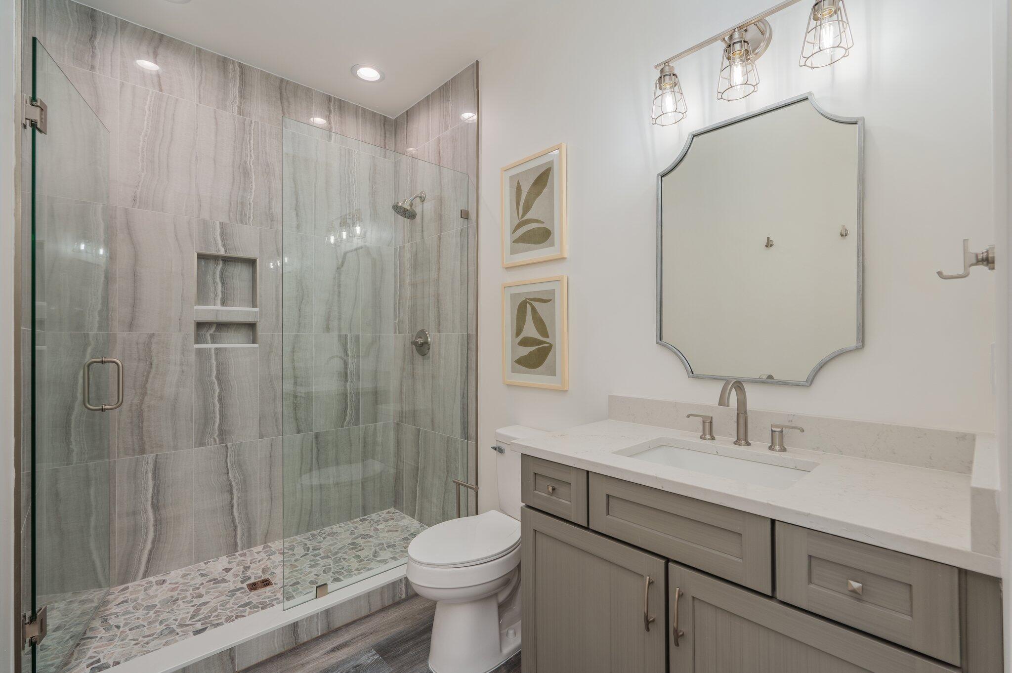 59 Marthas Lane Santa Rosa Beach, FL 32459 - Photo 56 of 85 a bathroom with a sink a toilet and shower