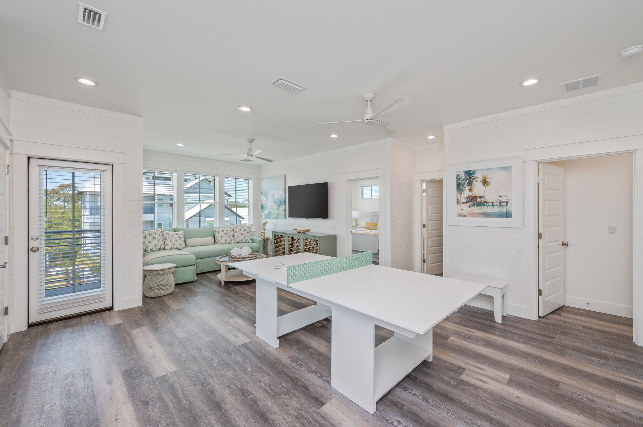 59 Marthas Lane Santa Rosa Beach, FL 32459 - Photo 58 of 85 a living room with furniture wooden floor and a flat screen tv
