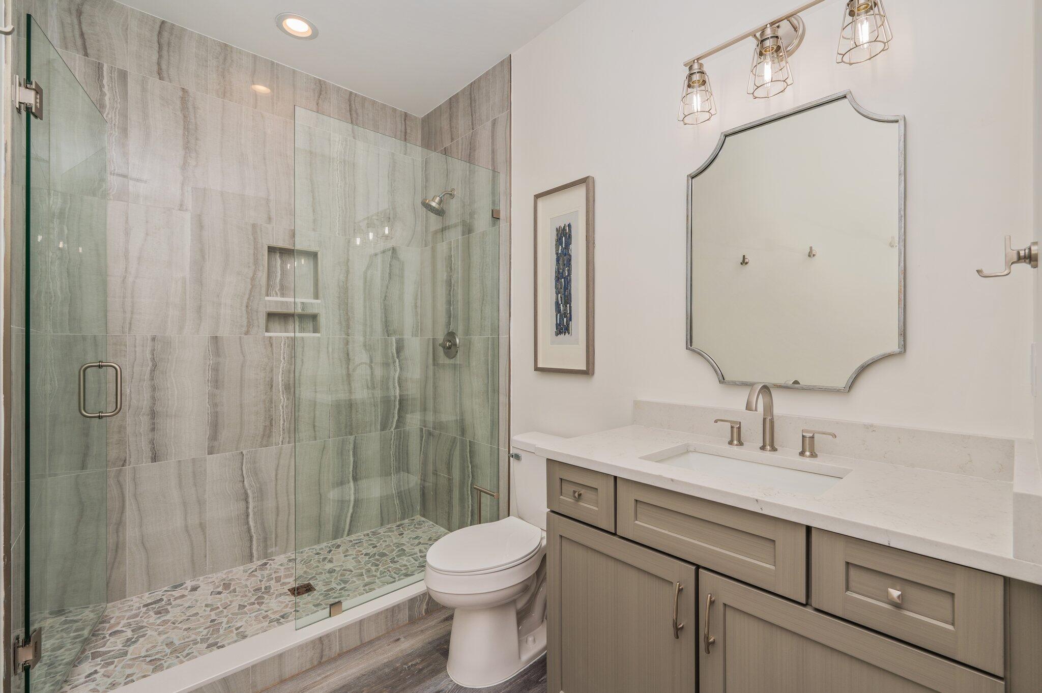 59 Marthas Lane Santa Rosa Beach, FL 32459 - Photo 73 of 85 a bathroom with a sink a toilet and shower