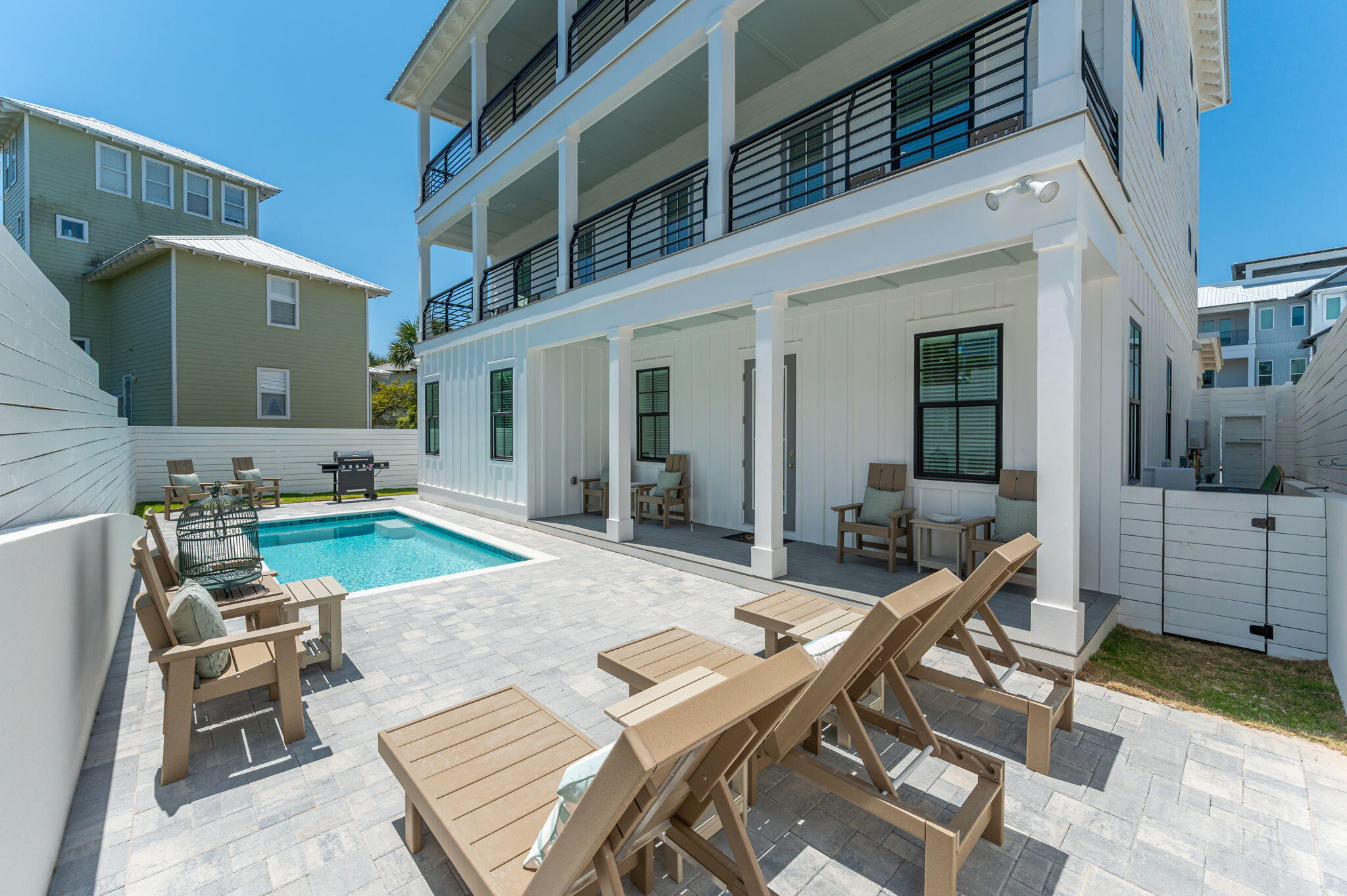 59 Marthas Lane Santa Rosa Beach, FL 32459 - Photo 9 of 85 a view of a patio with couches table and chairs with wooden floor